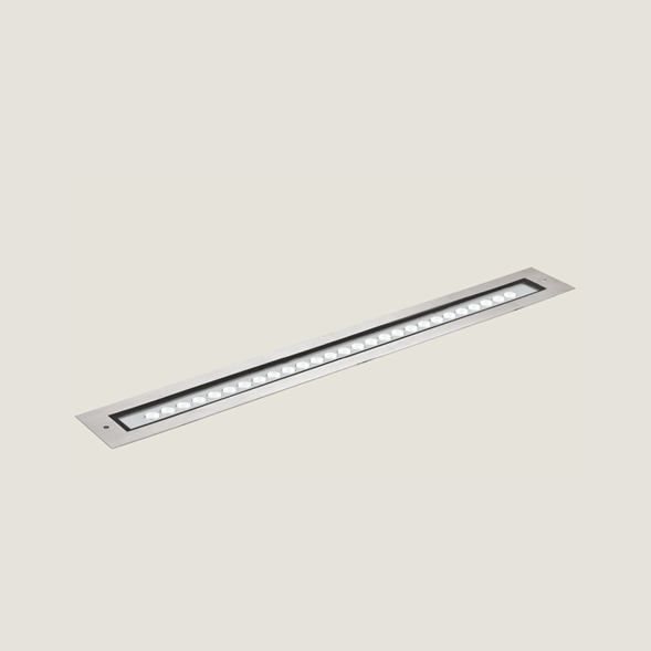 A large aluminium outdoor on floor light with a grey background.