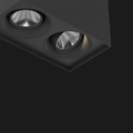 A black suspended box pendant light on a black background.