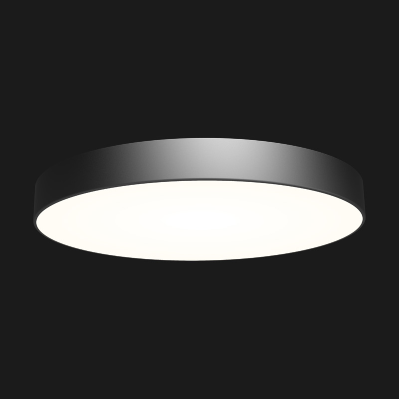 A black round pendant light with black background.