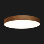 A corten round pendant light with black background.