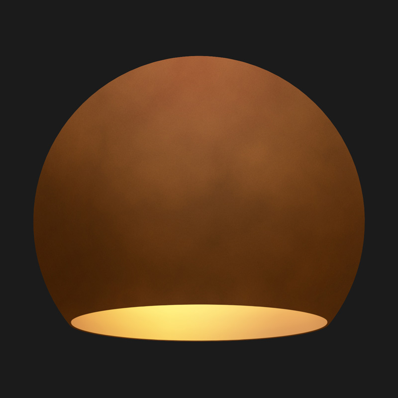A corten and gold globe pendant light on a black background.