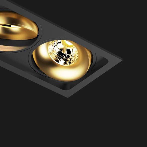 A black and gold 3 led downlight with black background