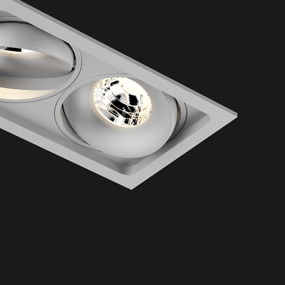 A grey 3 led downlight with black background