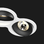 A black and white double 8 led downlight with black background
