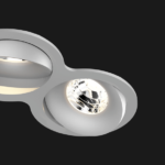 A grey double 8 led downlight with black background