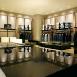 A luxury men clothes shop with led downlights.