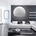 A moder design living room with a white sphere pendant light.